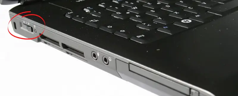 find a physical button on the side of the laptop